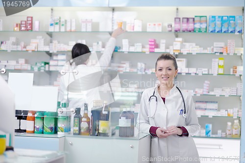 Image of team of pharmacist chemist woman  in pharmacy drugstore