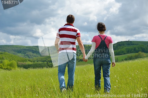 Image of romantic young couple in love together outdoor