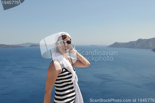 Image of Greek woman on the streets of Oia, Santorini, Greece