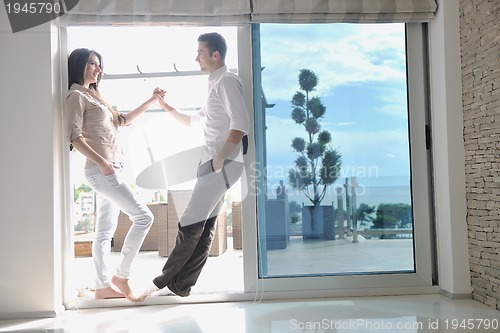 Image of happy young couple relax at home