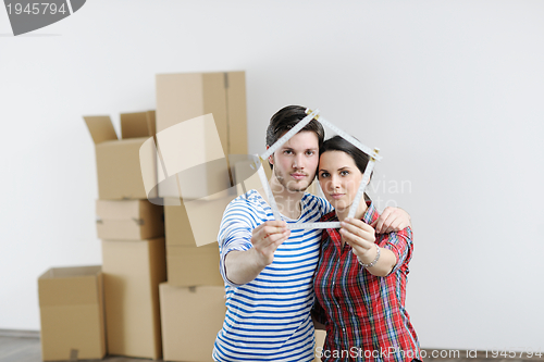 Image of Young couple moving in new house