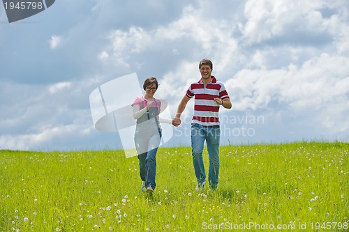 Image of romantic young couple in love together outdoor