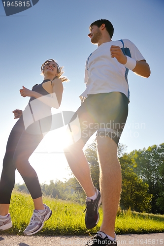 Image of Young couple jogging