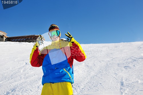 Image of skiing on fresh snow at winter season at beautiful sunny day