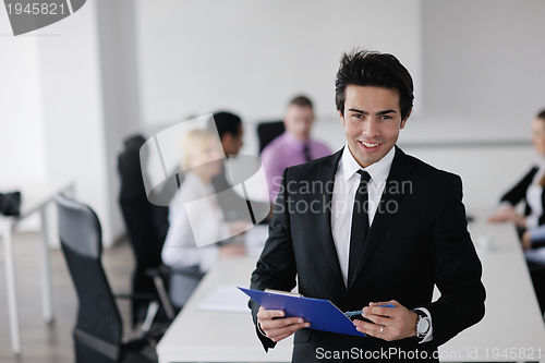 Image of young business man at meeting