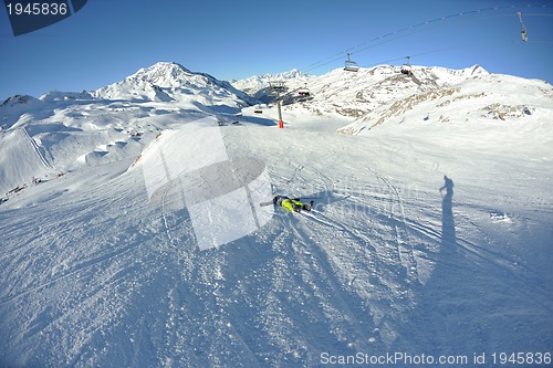 Image of skiing on fresh snow at winter season at beautiful sunny day