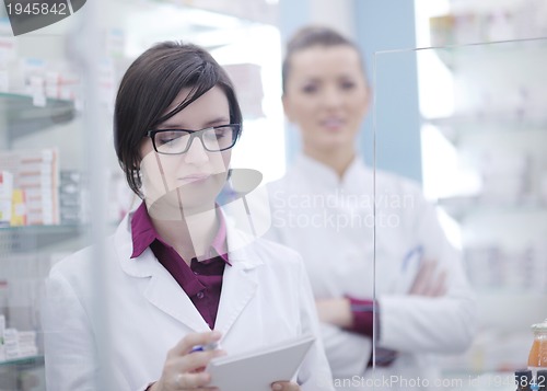 Image of team of pharmacist chemist woman  in pharmacy drugstore