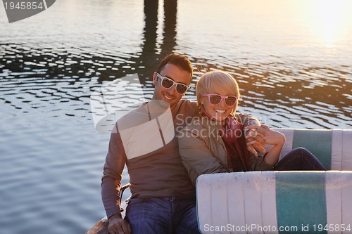 Image of couple in love  have romantic time on boat