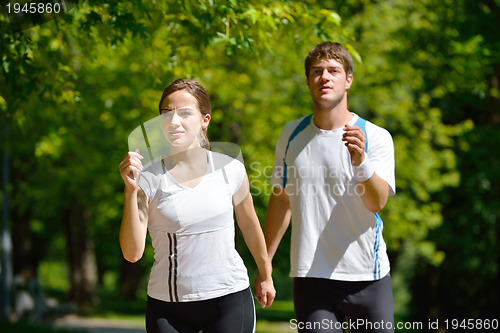 Image of Young couple jogging