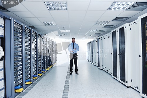 Image of young it engineer in datacenter server room