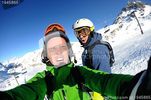 Image of winter portrait of friends at skiing