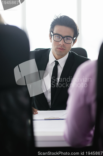 Image of young business man at meeting