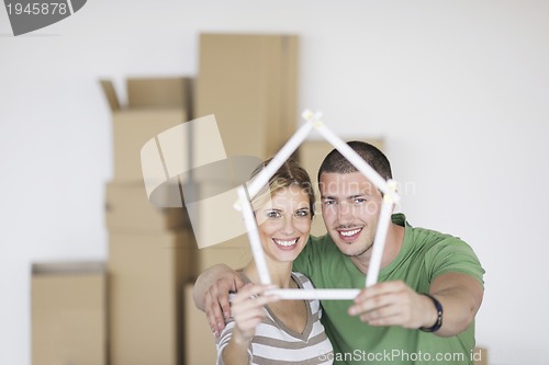 Image of Young couple moving in new home