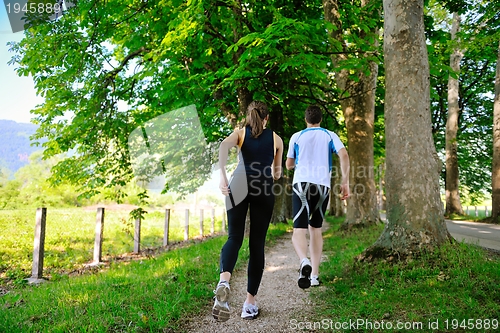 Image of Young couple jogging