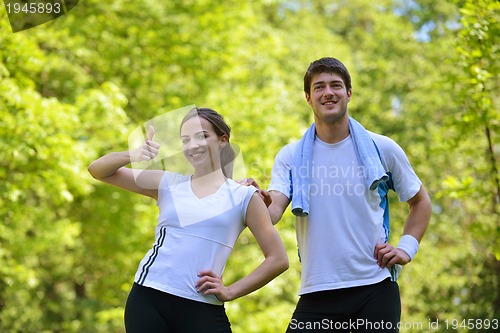 Image of Couple doing stretching exercise  after jogging