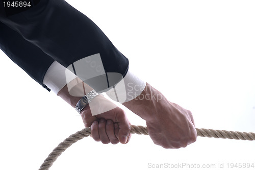 Image of business man with rope isolated on white background