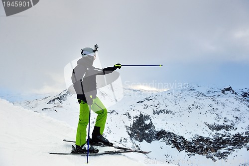 Image of skiing on fresh snow at winter season at beautiful sunny day