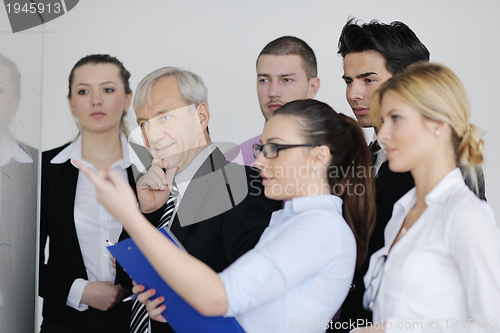 Image of Senior business man giving a presentation