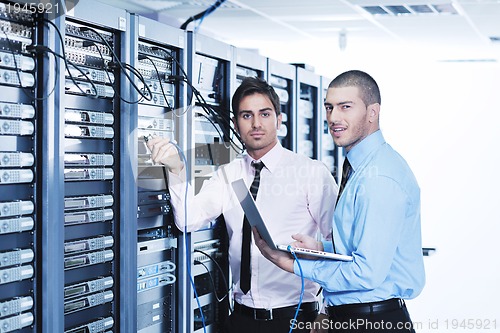 Image of it enineers in network server room