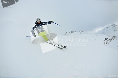 Image of skiing on fresh snow at winter season at beautiful sunny day