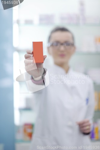 Image of pharmacist chemist woman standing in pharmacy drugstore