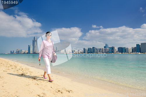 Image of happy tourist woman