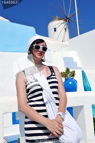 Image of Greek woman on the streets of Oia, Santorini, Greece