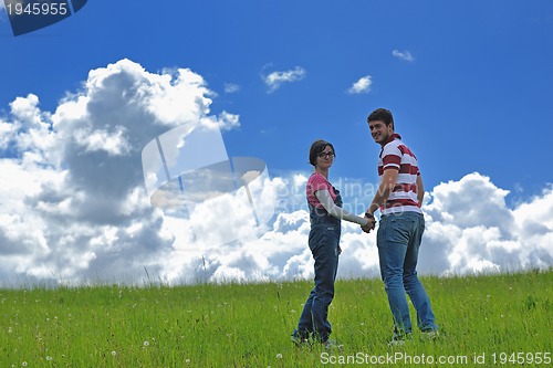 Image of romantic young couple in love together outdoor