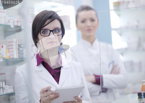 Image of team of pharmacist chemist woman  in pharmacy drugstore