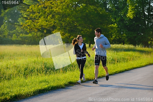 Image of Young couple jogging