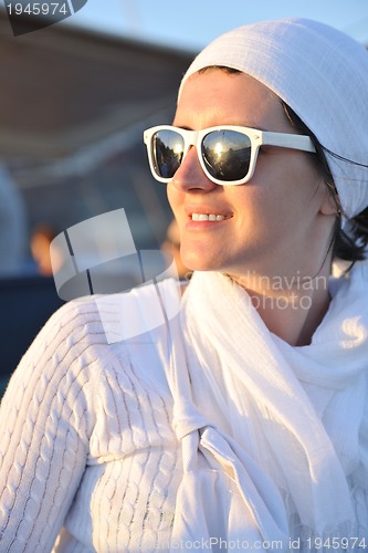 Image of Greek woman on the streets of Oia, Santorini, Greece