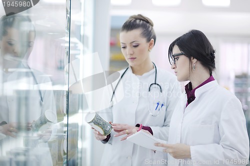 Image of team of pharmacist chemist woman  in pharmacy drugstore
