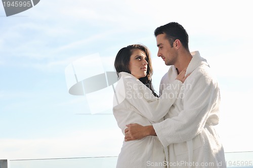 Image of couple relaxing on balcony