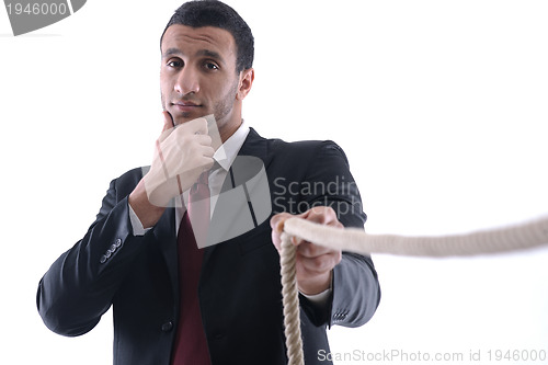 Image of business man with rope isolated on white background