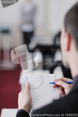 Image of business man on seminar