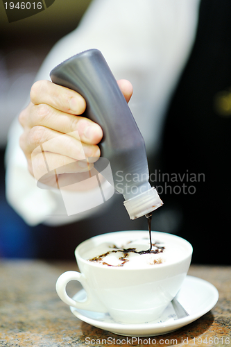 Image of Barista prepares cappuccino