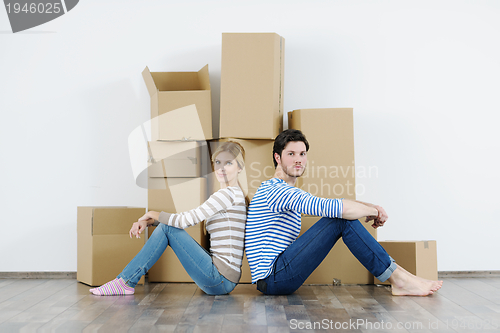 Image of Young couple moving in new house