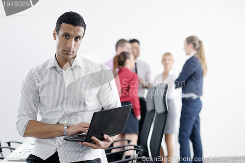 Image of young business man at meeting