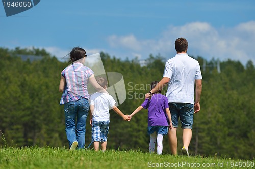 Image of happy young family have fun outdoors