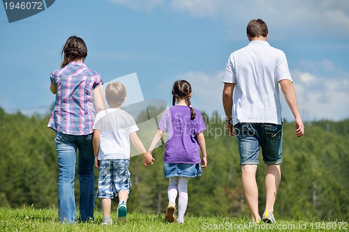 Image of happy young family have fun outdoors