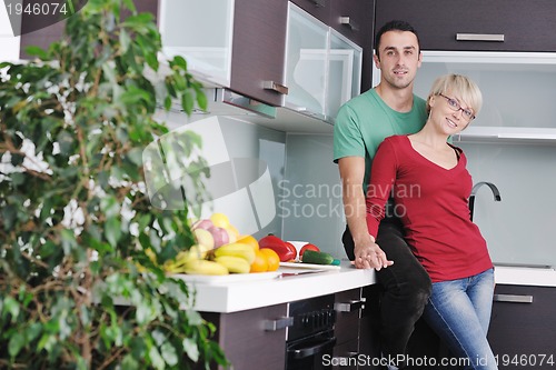 Image of young couple have fun in modern kitchen