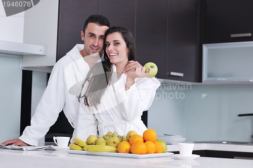 Image of young couple have fun in modern kitchen