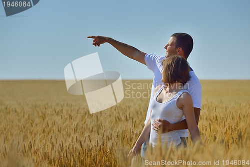Image of happy couple in wheat field