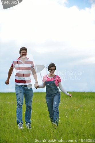 Image of romantic young couple in love together outdoor