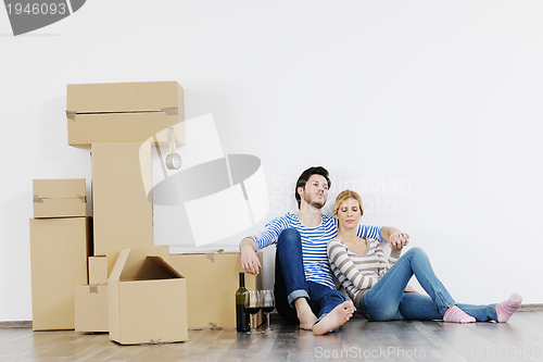 Image of Young couple moving in new house