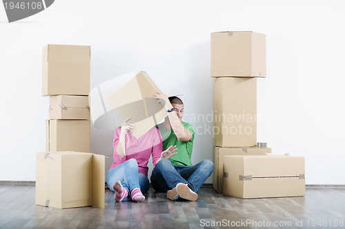 Image of Young couple moving in new house