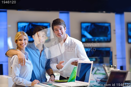 Image of people buy  in consumer electronics store