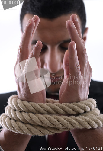 Image of business man with rope isolated on white background