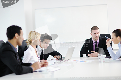 Image of Group of young business people at meeting