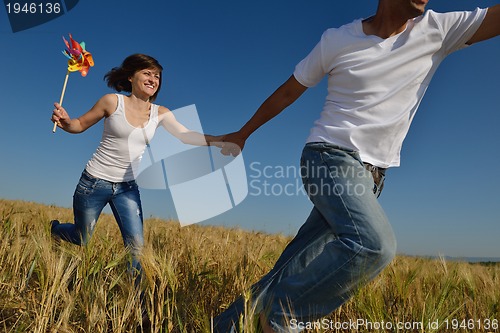 Image of happy couple in wheat field